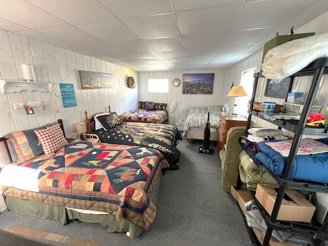 25722 Rainbow Dr, Sturgis, MI 49091 - carpeted bedroom featuring wooden walls and a drop ceiling