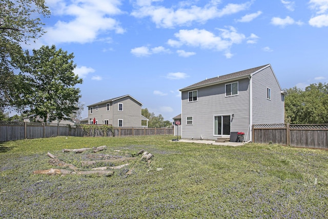 rear view of house with entry steps and a patio