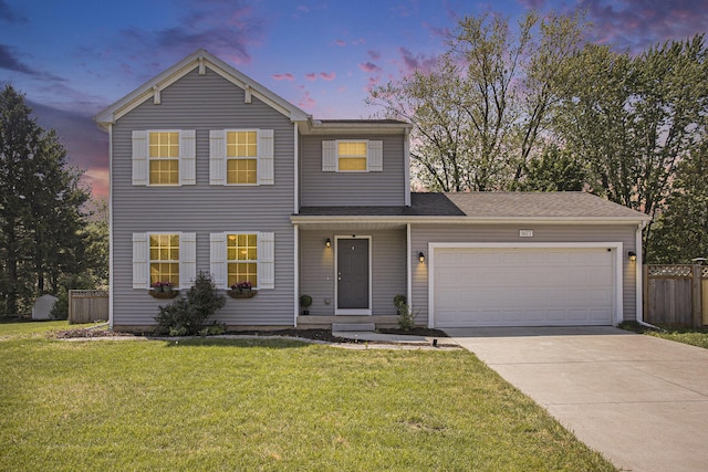 traditional-style home with driveway and an attached garage