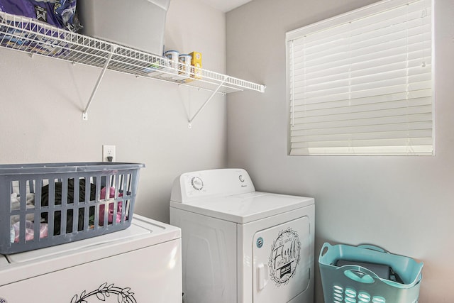 laundry room featuring washing machine and dryer
