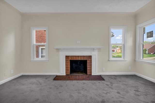 13575 Rutherford St, Detroit, MI 48227 - unfurnished living room with carpet floors, a fireplace, baseboards, and plenty of natural light