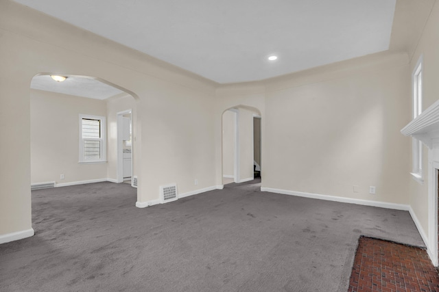 13575 Rutherford St, Detroit, MI 48227 - spare room featuring arched walkways, dark carpet, and recessed lighting