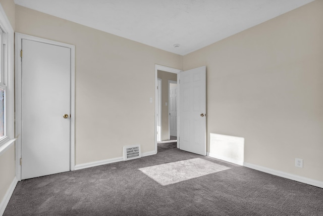 13575 Rutherford St, Detroit, MI 48227 - unfurnished bedroom with carpet and baseboards