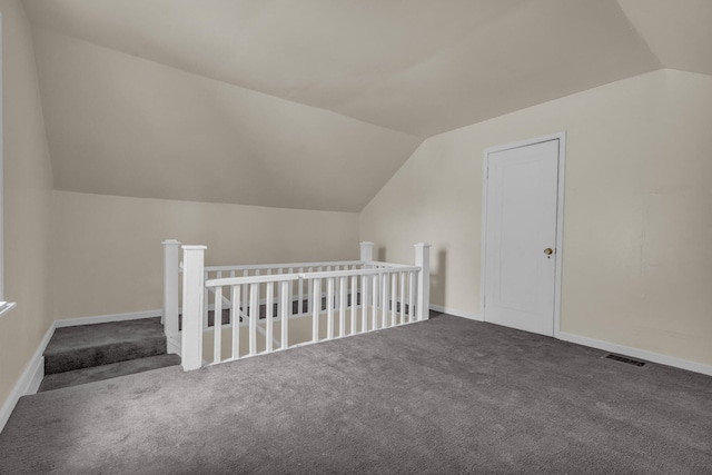 13575 Rutherford St, Detroit, MI 48227 - additional living space featuring vaulted ceiling, carpet, and baseboards