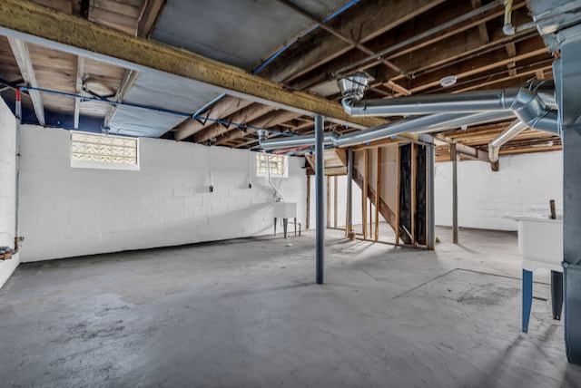 13575 Rutherford St, Detroit, MI 48227 - basement featuring a sink, concrete block wall, and plenty of natural light