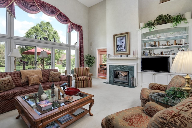 30465 Stonegate Dr, Franklin, MI 48025 - living room featuring a high ceiling, a fireplace, and carpet floors
