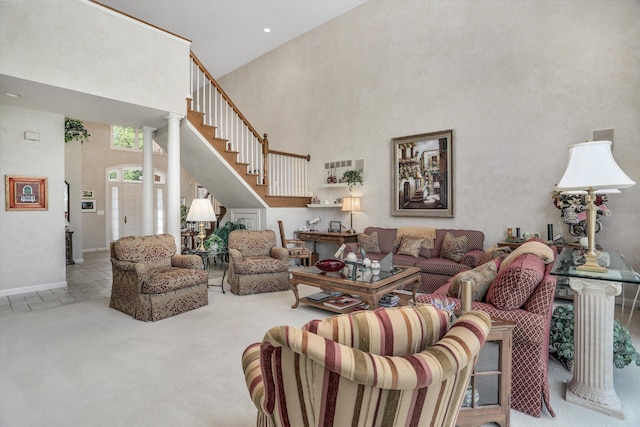 30465 Stonegate Dr, Franklin, MI 48025 - living room with a towering ceiling, carpet floors, baseboards, stairway, and recessed lighting