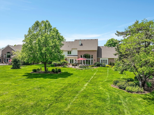 30465 Stonegate Dr, Franklin, MI 48025 - view of grassy yard with a patio area