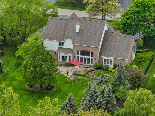 30465 Stonegate Dr, Franklin, MI 48025 - back of house with a patio, roof with shingles, and a yard