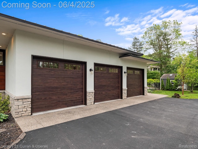 1985 Lone Pine Rd, Bloomfield Hills, MI 48302 - garage featuring asphalt driveway