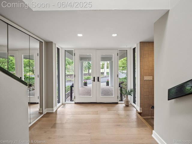 1985 Lone Pine Rd, Bloomfield Hills, MI 48302 - entrance foyer with french doors, a wall of windows, wood finished floors, recessed lighting, and baseboards