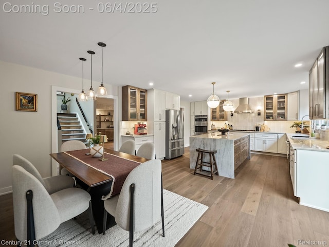 1985 Lone Pine Rd, Bloomfield Hills, MI 48302 - dining space with stairs, recessed lighting, and wood finished floors