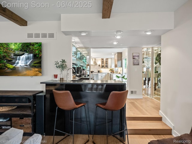 1985 Lone Pine Rd, Bloomfield Hills, MI 48302 - bar area with beam ceiling, wood finished floors, and a sink