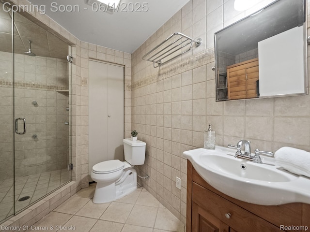 1985 Lone Pine Rd, Bloomfield Hills, MI 48302 - bathroom with tile walls, vanity, tile patterned floors, toilet, and a stall shower
