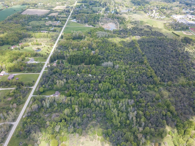 7642 Jordan Rd, Yale, MI 48097 - aerial view of property and surrounding area with a heavily wooded area