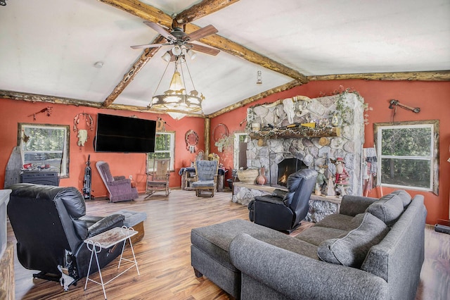 living room with plenty of natural light, a ceiling fan, and wood finished floors