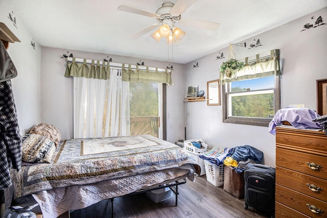 bedroom with wood finished floors and a ceiling fan