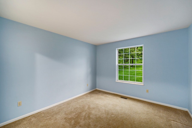 225 Brookwood Dr Unit 4, South Lyon, MI 48178 - spare room featuring carpet and baseboards