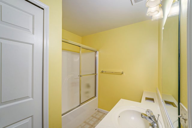 225 Brookwood Dr Unit 4, South Lyon, MI 48178 - bathroom with enclosed tub / shower combo, tile patterned floors, vanity, and baseboards