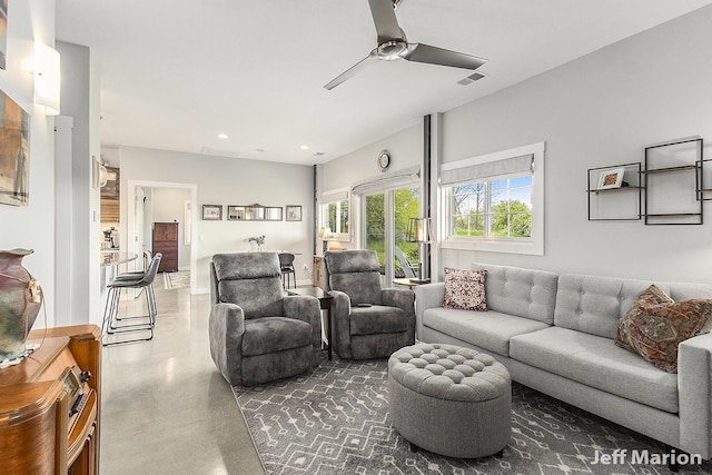 1525 W David Hwy, Ionia, MI 48846 - living area with concrete flooring, a ceiling fan, and recessed lighting