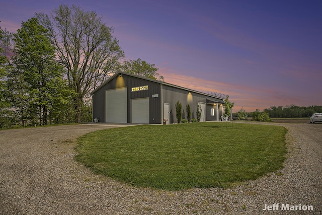 1525 W David Hwy, Ionia, MI 48846 - view of front of house with a garage, a yard, an outbuilding, and driveway