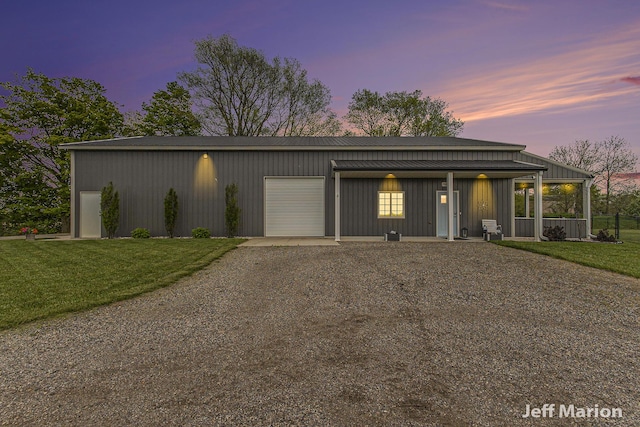 1525 W David Hwy, Ionia, MI 48846 - mid-century home featuring driveway, a garage, and a lawn