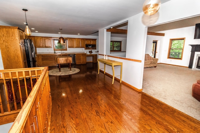4707 Mount Morris Rd, Columbiaville, MI 48421 - kitchen featuring freestanding refrigerator, brown cabinetry, dishwasher, dark wood-type flooring, and recessed lighting