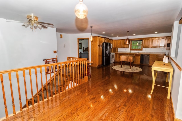 4707 Mount Morris Rd, Columbiaville, MI 48421 - corridor featuring an upstairs landing, dark wood-type flooring, recessed lighting, and a sink