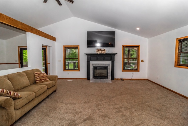4707 Mount Morris Rd, Columbiaville, MI 48421 - carpeted living room with vaulted ceiling, a premium fireplace, a ceiling fan, and plenty of natural light