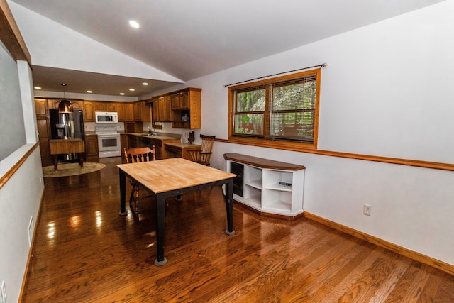 4707 Mount Morris Rd, Columbiaville, MI 48421 - dining area featuring lofted ceiling, dark wood-type flooring, recessed lighting, and baseboards