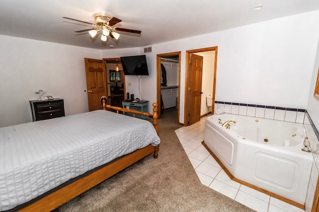 4707 Mount Morris Rd, Columbiaville, MI 48421 - bedroom with light tile patterned floors, light carpet, a spacious closet, a closet, and a ceiling fan