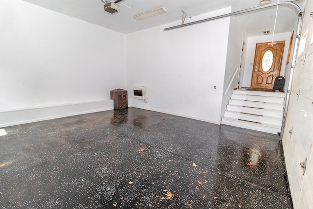 4707 Mount Morris Rd, Columbiaville, MI 48421 - garage with a garage door opener and baseboards