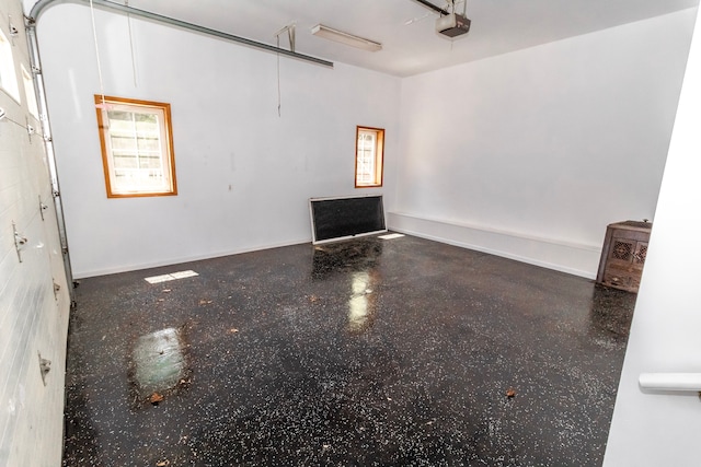 4707 Mount Morris Rd, Columbiaville, MI 48421 - unfurnished living room with a garage