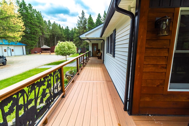 4707 Mount Morris Rd, Columbiaville, MI 48421 - deck featuring a detached garage