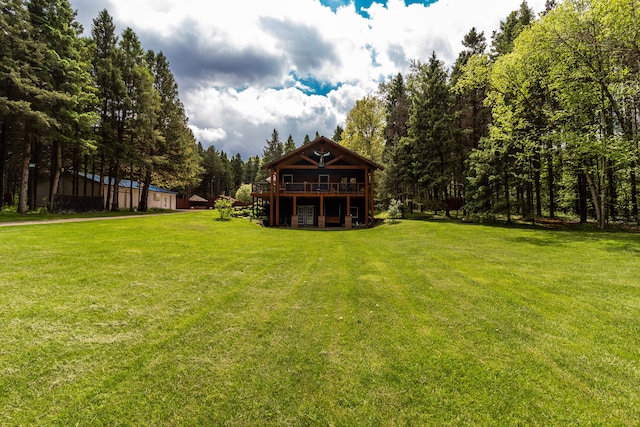 4707 Mount Morris Rd, Columbiaville, MI 48421 - view of green lawn with a wooden deck