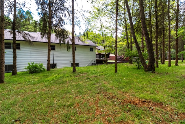 4707 Mount Morris Rd, Columbiaville, MI 48421 - view of green lawn featuring a wooden deck