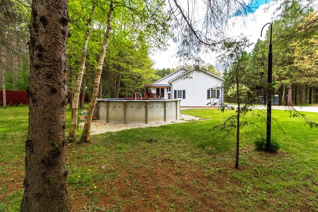 4707 Mount Morris Rd, Columbiaville, MI 48421 - view of green lawn with an outdoor pool