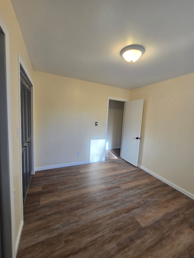 7400 Willow, Lexington, MI 48450 - unfurnished room with baseboards and dark wood-type flooring