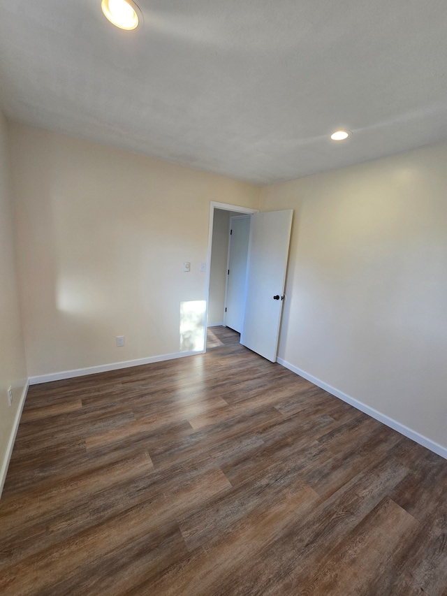 7400 Willow, Lexington, MI 48450 - unfurnished room featuring baseboards, dark wood-type flooring, and recessed lighting