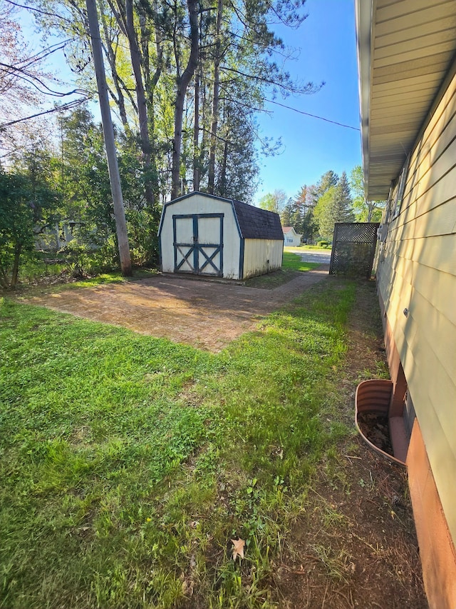 7400 Willow, Lexington, MI 48450 - view of grassy yard with a shed, an outbuilding, and driveway