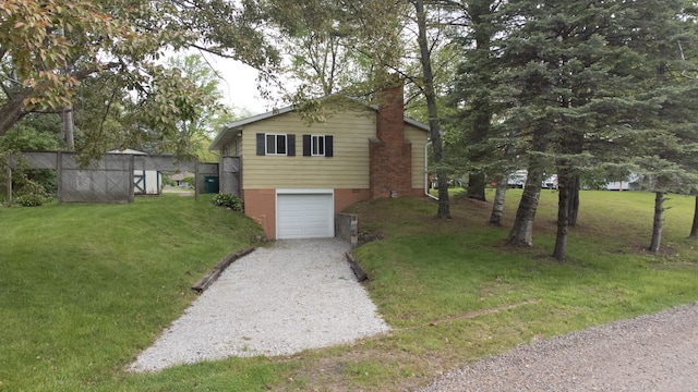 7400 Willow, Lexington, MI 48450 - view of front of property featuring an attached garage, a chimney, driveway, and a front yard
