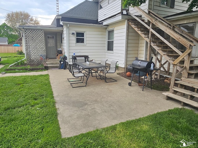 view of patio / terrace featuring grilling area and stairs