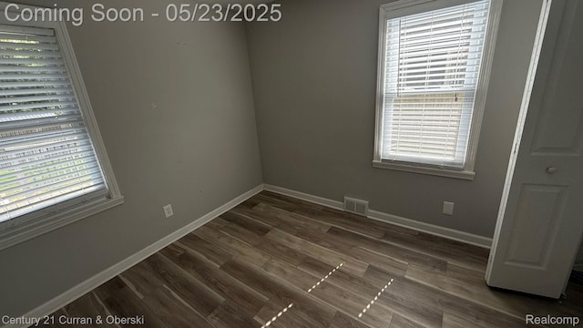 648 W Hazelhurst St, Ferndale, MI 48220 - spare room with plenty of natural light, baseboards, and dark wood-type flooring