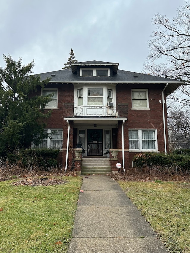 2105 Burns St, Detroit, MI 48214 - american foursquare style home with covered porch, brick siding, and a front yard