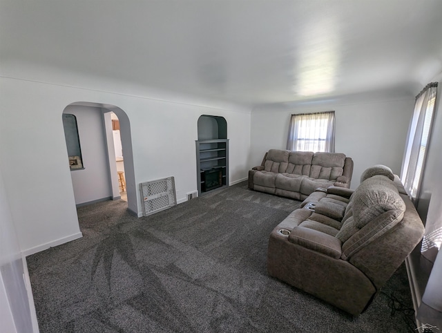 4515 N Michigan Rd, Carrollton, MI 48604 - living area with carpet floors, arched walkways, and baseboards