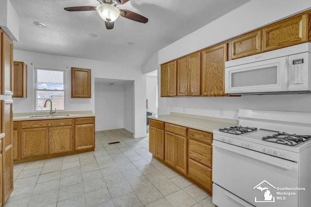 7316 Summerfield Rd, Lambertville, MI 48144 - kitchen featuring white appliances, vaulted ceiling, ceiling fan, a sink, and light countertops