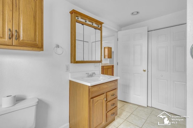 7316 Summerfield Rd, Lambertville, MI 48144 - bathroom with toilet, vanity, tile patterned floors, and a closet