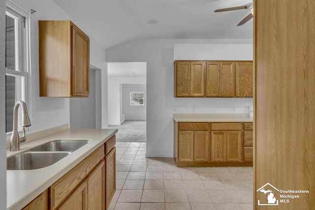 7316 Summerfield Rd, Lambertville, MI 48144 - kitchen with a sink, a ceiling fan, lofted ceiling, light countertops, and light tile patterned floors