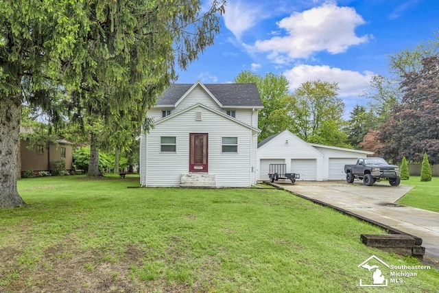 7316 Summerfield Rd, Lambertville, MI 48144 - view of front of house featuring an outbuilding, a detached garage, a front yard, and roof with shingles