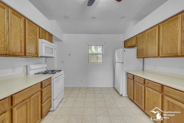 7316 Summerfield Rd, Lambertville, MI 48144 - kitchen with white appliances, light countertops, and brown cabinets
